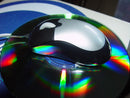 Mouse Mini on cd with rainbow reflections